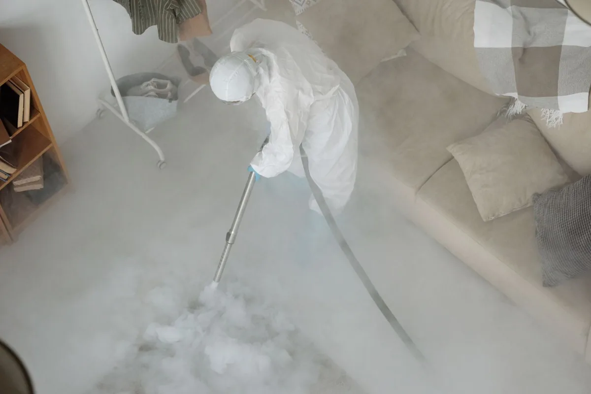 Biohazard cleanup technician in protective equipment, San Pasqual, CA